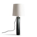 James Table Lamp with a cylindrical dark grey base and beige shade on a white background