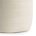 Close-up of a textured beige lamp base on a white background