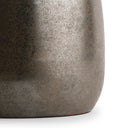 Close-up of a textured ceramic table lamp vase on a white background
