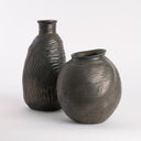 Two brown textured vases on a white background