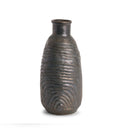 Textured bronze vase on a white background