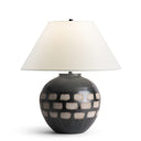 Table lamp with a checkered design base on a white background