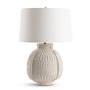 Kate Table lamp with textured ceramic base and white shade on a white background