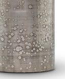 Close-up of a textured cylindrical Kelly Table Lamp with a pattern of raised circles.