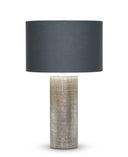 Kelly Table Lamp with a textured base and black shade on a white background