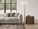 Modern living room with a beige sofa, side table, and Manor Floor Lamp.