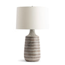 Marilyn Table lamp with striped ceramic base and white shade on a white background