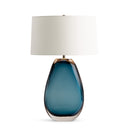 Blue glass table lamp with a white shade on a white background