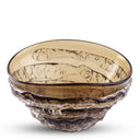 A decorative glass bowl with a wavy, textured base and a translucent amber-brown interior, shown on a clean white background.