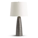 Table lamp with a white shade and metallic base on a white background