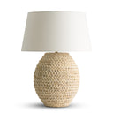 Oristano Table lamp with woven corn husk base and white shade on a white background