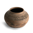 Brown ceramic pot with decorative patterns on a white background