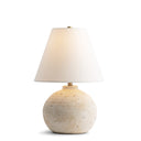Roscoe Table lamp with a textured ceramic base and white shade on a white background