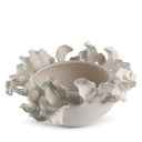 Decorative ceramic bowl with shell-like design on a white background