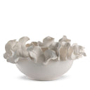 White ceramic bowl with ruffled edge on a white background