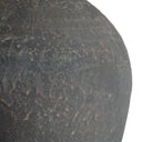 Close-up detail of Theo table lamp base showing textured dark brown ceramic glaze finish.